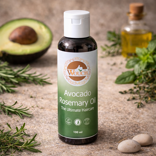 Wouch Avocado Rosemary Oil 100ml bottle on natural background, Avocado Rosemary Hair Oil professional product shot, Wouch herbal haircare oil with avocado and rosemary, Dark amber bottle with green gradient label skincare product, Natural vintage style avocado rosemary oil bottle, Premium avocado rosemary oil for hair growth, Wouch Care avocado oil with rosemary extract, Herbal hair oil bottle with white flip cap, Avocado and rosemary infused scalp treatment oil, Professional skincare brand Wouch oil produc